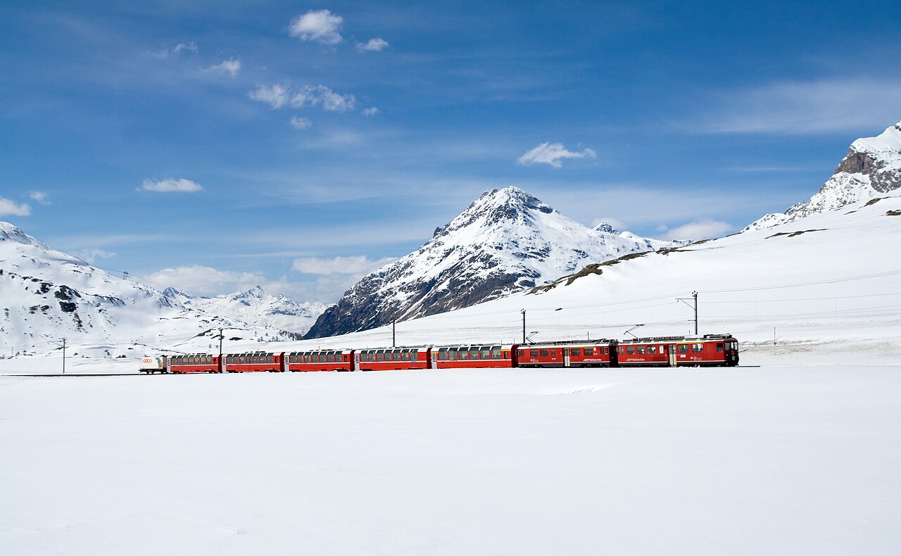 Bernina Express crossing the snowy Bernina Pass in winter